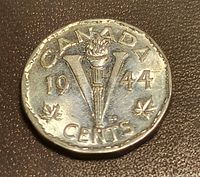 Reverse of 1944 Victory nickel showing torch and V