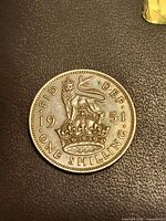 Reverse of 1951 one shilling coin showing crowned lion design and date
