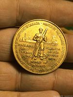 Obverse side with miner, metal list, Sudbury reference