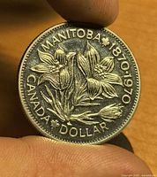 Reverse of coin showing Manitoba floral design and inscriptions