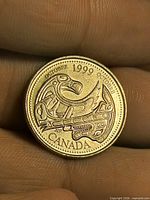 Reverse showing raven design, year, bilingual month