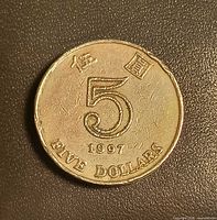 Obverse showing large numeral 5, Chinese character, date 1997, denomination FINE DOLLARS
