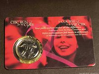 Front of holder showing coin and CIBC Run for the Cure graphics