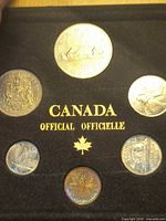 Coin set insert showing six coins and gold lettering