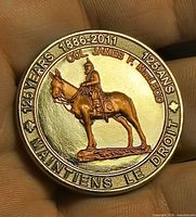 Obverse showing Col. James F. Macleod on horseback with 125 years text
