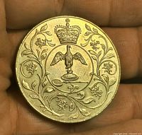 Reverse side with crowned eagle and floral scroll