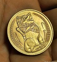 Reverse showing seated lion design