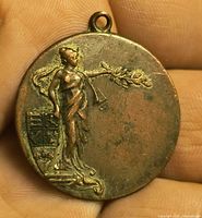 Obverse of bronze medal showing figure and coat of arms
