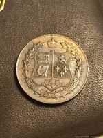 Obverse with Canadian coat of arms, motto visible