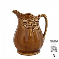 Left side view of amber glazed wheat motif creamer pitcher