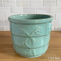 Planter front view showing overall shape, glaze colour and pattern