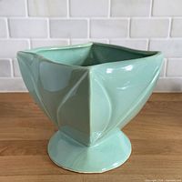Front view of aqua twisted square stoneware planter
