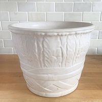 Front view showing palm leaf relief pattern and matte finish