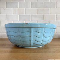 Side view showing wave pattern and chip on rim