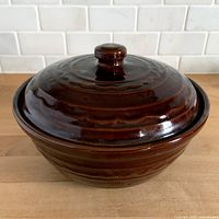Top-angle view of lidded casserole showing overall form and glaze