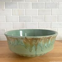 Overhead perspective of green drip glaze stoneware bowl