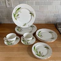 Full lot showing plates, cups, saucers