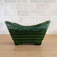 Side view of rectangular green drip glaze ribbed ceramic planter