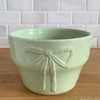 Mint green Robinson Ransbottom bow jardiniere planter front view