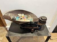 Full view of scale with tray containing art glass and weights on weight post