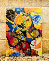 Full view of unframed abstract painting against stone backsplash