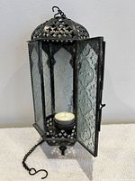 Lantern door open showing interior tealight and pierced dome