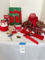 overview of all holiday bows, ribbons, ornaments and picks on table