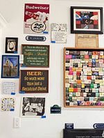 Overall wall view showing majority of signs, prints and tiles