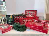Group shot showing boxes of ornaments, string light box, and garland