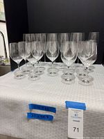 Group of clear red wine glasses on table