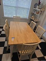 Overall view of rectangular dining table with six chairs