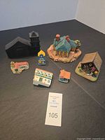 Group shot of all seven resin buildings