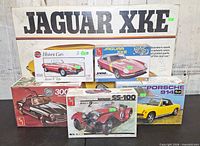 Group shot of six model car kit boxes