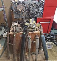 Overall view showing cooling fans, fan clutch, shocks, exhaust pipes and hose bundle