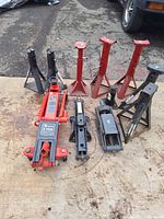 Group view of floor jack, scissor jacks and six jack stands