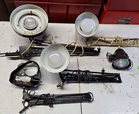 Overview of four desk lamps with shades and arms