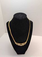 Necklace on display bust, showing full front design