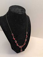 Full necklace on display bust showing overall design and length