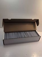 White 800-count card storage box opened showing rows of MTG cards