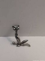 Front view of silver-tone cat brooch with rhinestone collar