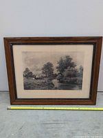 Full view of framed photogravure landscape print with measuring tape for scale