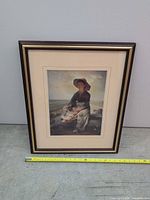 Full view of framed print with tape for scale