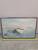 Front view of framed seascape painting