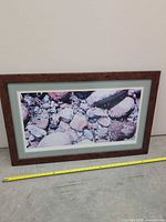 Front view of framed print with measuring tape