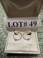 Earrings in presentation box showing overall design