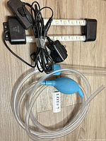 LED light fixtures, power adapters, tubing siphon laid out