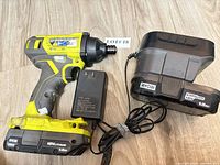 Impact driver with battery, charger dock, AC adapter
