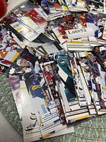 Stacks of Upper Deck hockey cards spread out, showing player images and silver foil logos