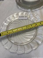 Top view of 9 in. plate with measuring tape