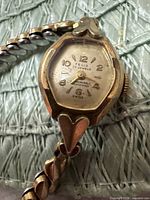 Front view of Telis wristwatch showing dial text, case shape and heart lug